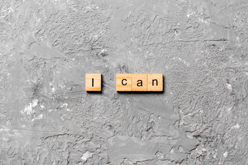 i can word written on wood block. i can text on cement table for your desing, concept