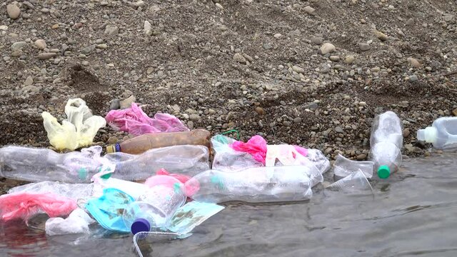 Accumulation of the plastic waste in a shallow of a mountain river, environmental pollution