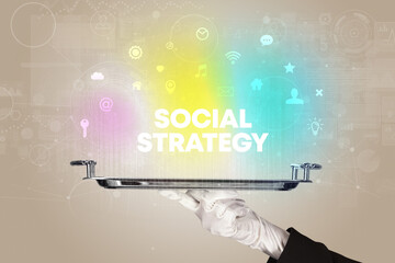 Waiter serving social networking with SOCIAL STRATEGY inscription, new media concept