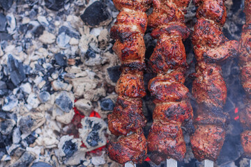 Delicious shish kebab is prepared on the grill