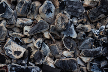 Black hot coal, close-up. Black charcoal background