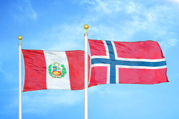 Peru and Norway two flags on flagpoles and blue sky