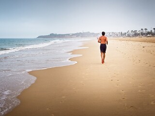 man running on the beach