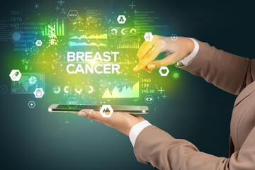 Close-up of a touchscreen with BREAST CANCER inscription, medical concept