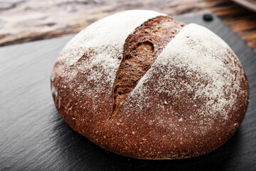 homemade bread on a black background