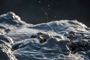 Splashes of the mud, breaking out of the crater of mud volcano