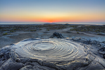 Bubbling crater of a mud volcano. Active mud volcano in Gobustan desert, Azerbaijan