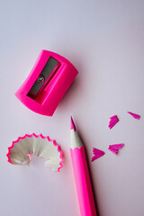pink pencil with shavings and sharpener. school and education concept.