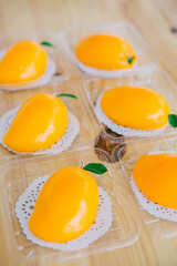 Thai Mango Cake with fresh mango on wood table