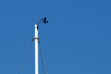 meteorological device for measuring wind speed against a blue sky