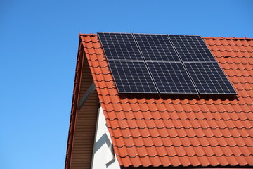 Fototapeta premium Photovoltaic cells on the roof of the house