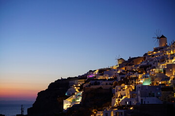Sunset view and beautiful buildings lighted by sunset in santorini island, Greece, Europe