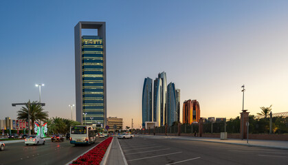 Beautiful city roads and towers at sunset | View of Abu Dhabi city Etihad towers and iconic...