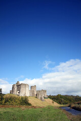 Fototapeta na wymiar Kidwelly Castle gatehouse by the River Gwendraeth Wales Carmarthenshire UK a ruin of a 13th century medieval fort and a popular travel destination visitor attraction landmark of the city stock photo