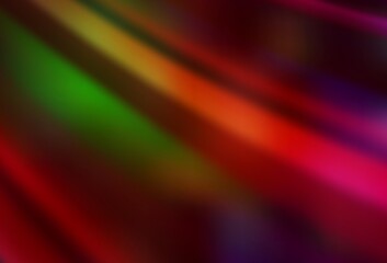 Dark Green, Red vector blurred shine abstract texture.