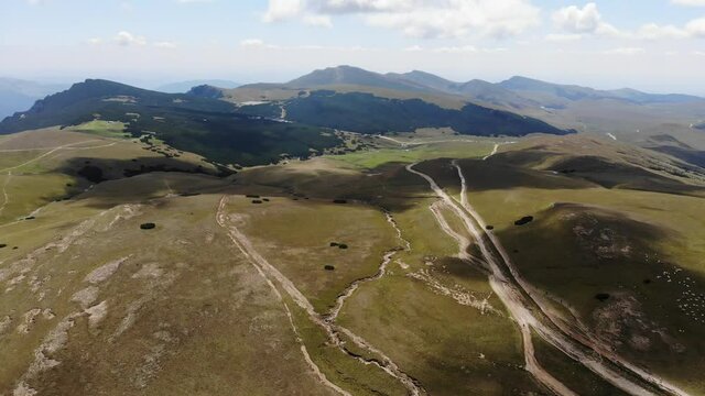 Aerial view of the mountain trail linking Piatra Arsa and Babele Cabin on a sunny summer day