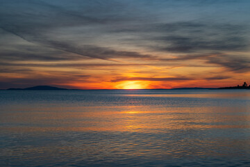 Fototapeta na wymiar Croatia, island of Pag, beautiful dramatic sunset over Adriatic sea horizon, colorful red sky 