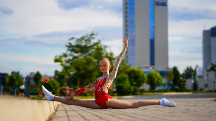 Portrait of young gymnast girl in sport suits