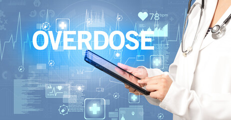 young doctor writing down notes with OVERDOSE inscription, healthcare concept
