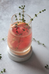 Lemonade with grapefruit. Refreshing decanter and glass of orange lemonade