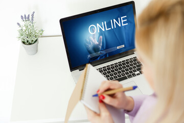 Close-up Of Young Woman Using Laptop online