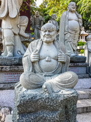 Fototapeta na wymiar Statue on the territory of Buddhist center Nanshan
