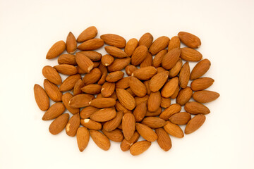 Group of almonds isolated on white, top view.