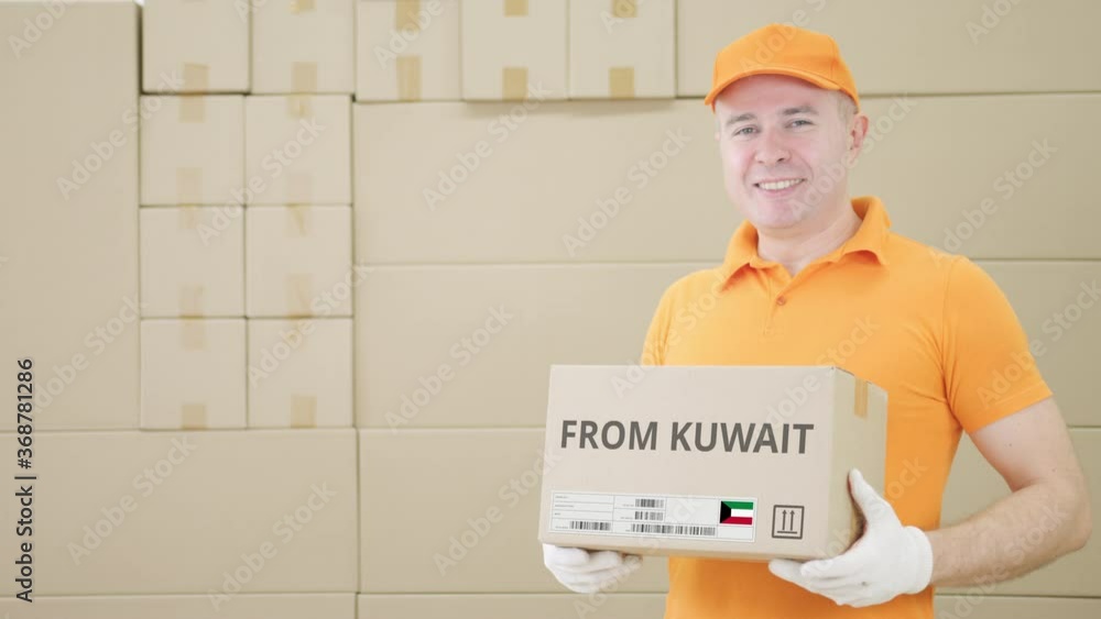 Aufkleber warehouse worker holds cardboard box with printed from kuwait text on it