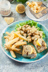 Steamed cod fish with french fries and boiled cauliflower