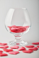 red hearts on a white background in a glass jar