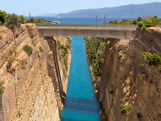 View from the bridge to the boats and yachts passing through the Corinth Canal from a sunny day on...
