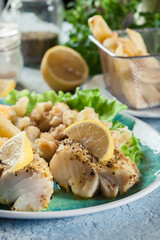 Steamed cod fish with french fries and boiled cauliflower