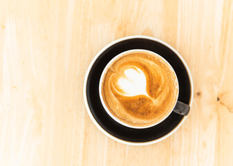 black cup of cappuccino top view 