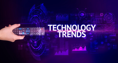 hand holding wireless peripheral with TECHNOLOGY TRENDS inscription, modern technology concept