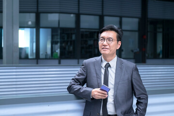 Portrait of a Chinese businessman, smiling and looking up