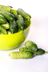 Fresh cucumbers on a white background.