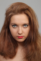 Fototapeta premium young, beautiful woman with red hair