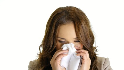 Ill businesswoman using tissue.