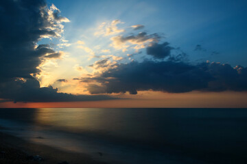 Fototapeta na wymiar sea tide and sunset on the beach