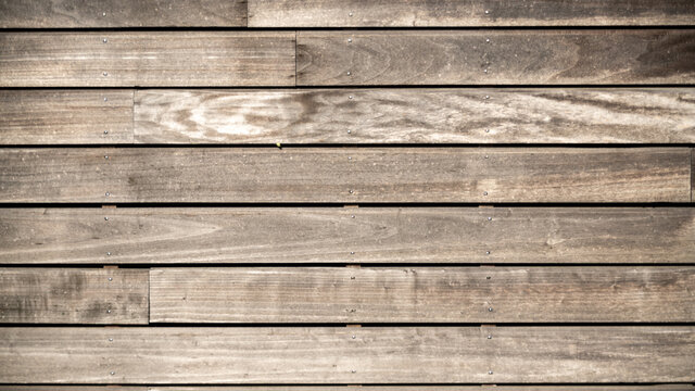 
Close-up of worn brown gray wooden slats, horizontal, background