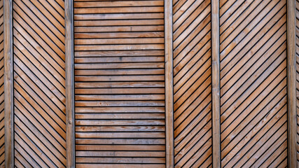 
Light wooden slats arranged in different directions, background