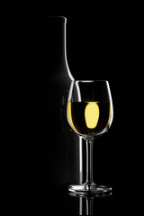 Glass of white wine next to a bottle backlit on a black background. 3d illustration.