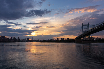 Fototapeta na wymiar Beautiful Sunset with the Triborough Bridge connecting Astoria Queens New York to Wards and Randall's Island over the East River