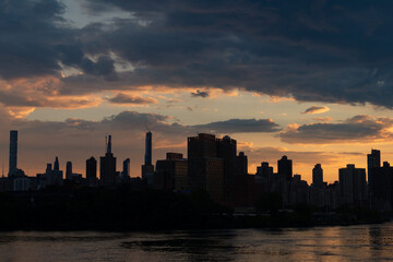 Manhattan Skyline Silhouette along the East River during Sunset in New York City