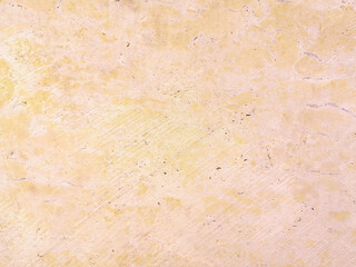 
Background, degraded light ocher wall
