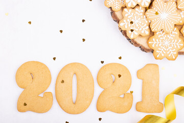 Multi-colored confectionery with sugar sprinkles and gingerbread in the form of numbers 2021