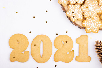 Multi-colored confectionery with sugar sprinkles and gingerbread in the form of numbers 2021