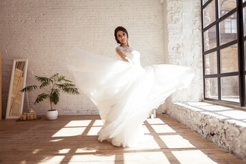 
the bride is dancing at the windows