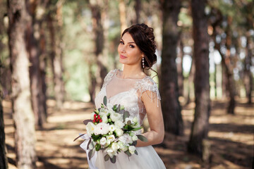 newlyweds in a pine forest