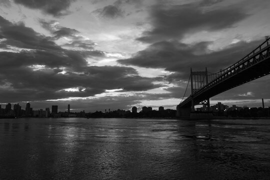 Black and White Image of the Triborough Bridge during a Sunset over the East River connecting Astoria Queens New York to Wards and Randall's Island